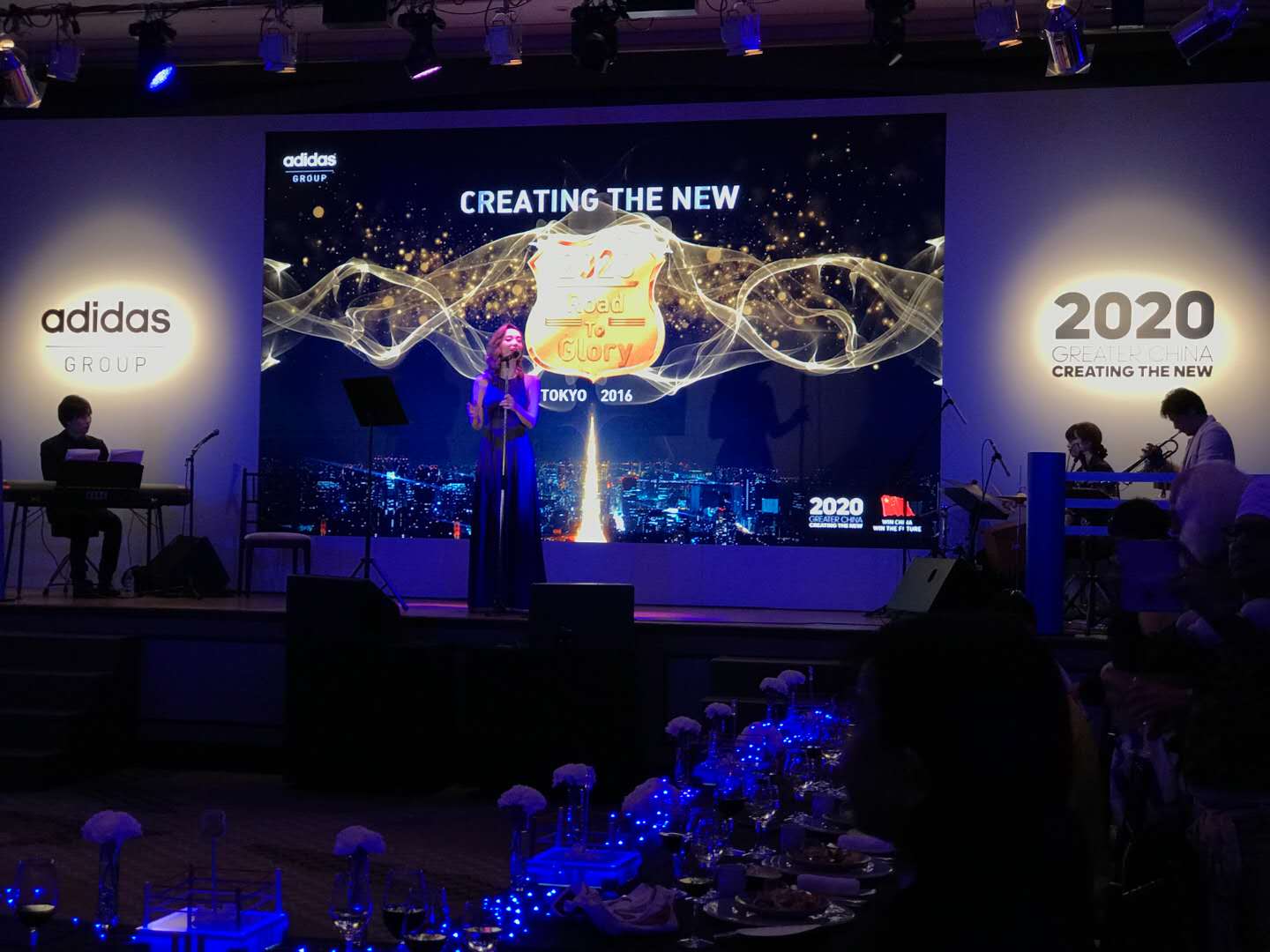 Gala dinner event with formal dining setup, elegant decorations, and sophisticated ambiance